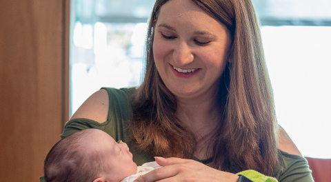 Heather, holding baby