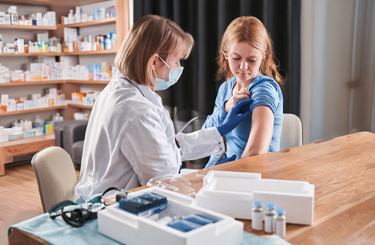 pharmacist vaccinating a patient